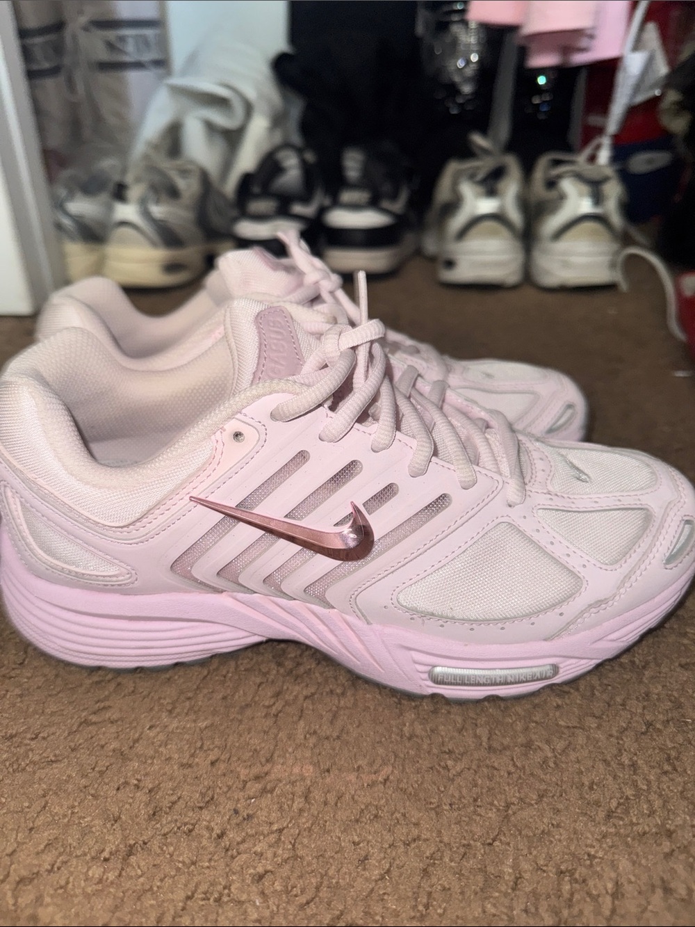 Nike Women's Light Pink Athletic Sneakers with Metallic Rose Swoosh